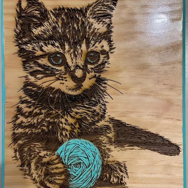 Kitten with yarn ball laser engraved on wood