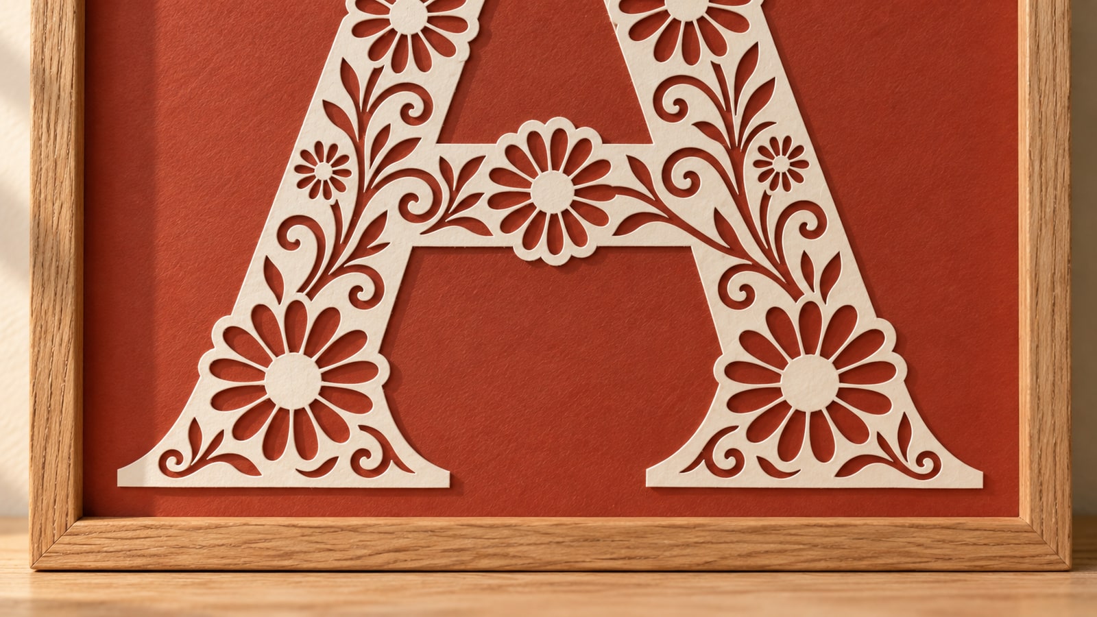 Close view of the same ivory floral A showing thin paper edges against continuous terracotta backing